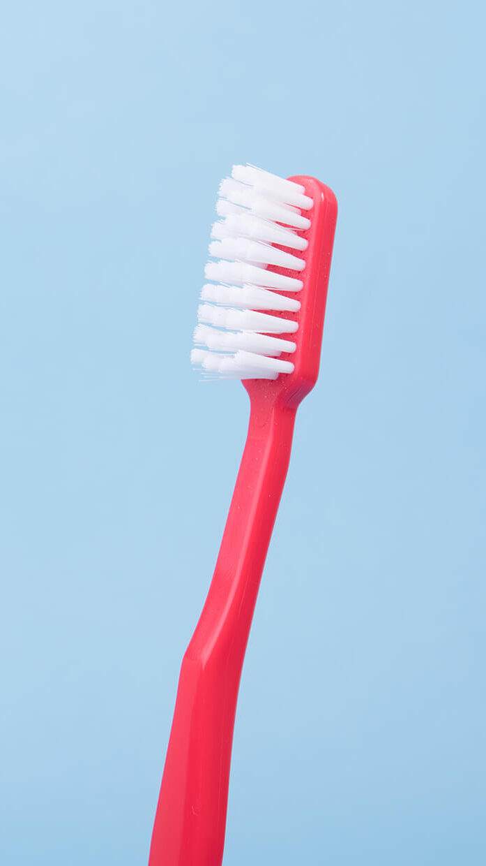 Pink toothbrush.